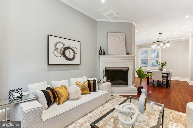1314 Wallach Pl NW, Washington, DC 20009 - living room with crown molding, dark wood finished floors, a fireplace, baseboards, and recessed lighting