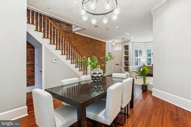 1314 Wallach Pl NW, Washington, DC 20009 - dining space featuring baseboards, brick wall, stairs, wood finished floors, and ornamental molding