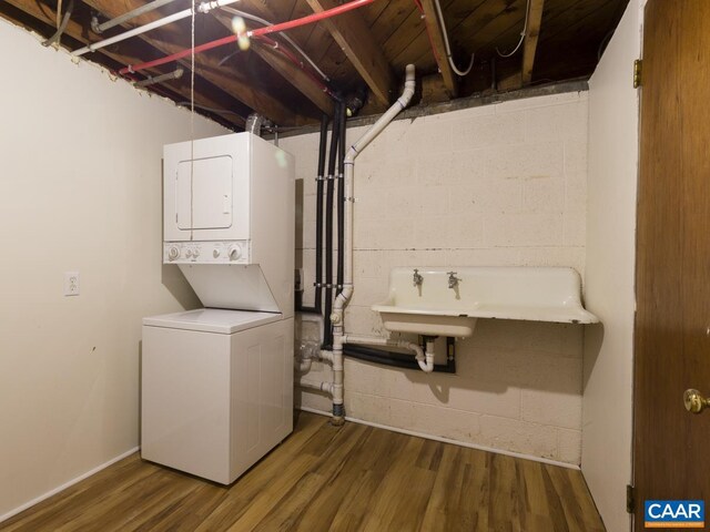 821 Cabell Ave Unit A & B, Charlottesville, VA 22903 - laundry room with stacked washing machine and dryer and wood finished floors
