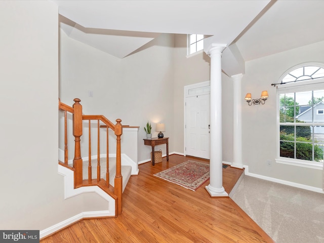9034 Allington Manor Cir W, Frederick, MD 21703 - foyer featuring ornate columns, plenty of natural light, wood finished floors, and stairs