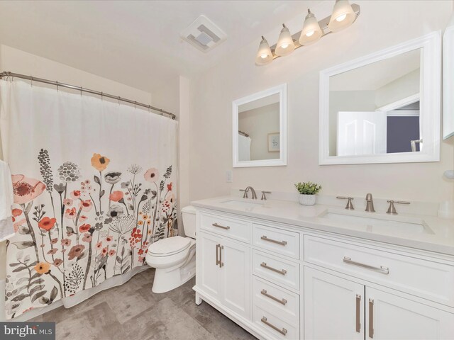 9034 Allington Manor Cir W, Frederick, MD 21703 - bathroom featuring double vanity and toilet