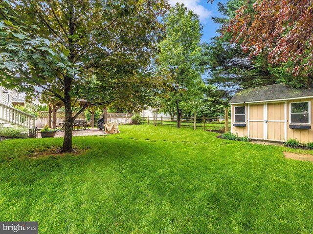 9034 Allington Manor Cir W, Frederick, MD 21703 - view of yard featuring a storage unit, an outbuilding, and a patio area