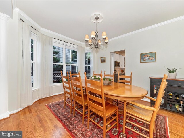 9034 Allington Manor Cir W, Frederick, MD 21703 - dining area with a chandelier, crown molding, and light wood-style floors