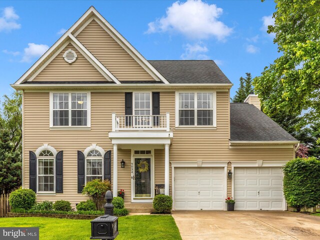 9034 Allington Manor Cir W, Frederick, MD 21703 - colonial home featuring a balcony, concrete driveway, a front lawn, and a shingled roof