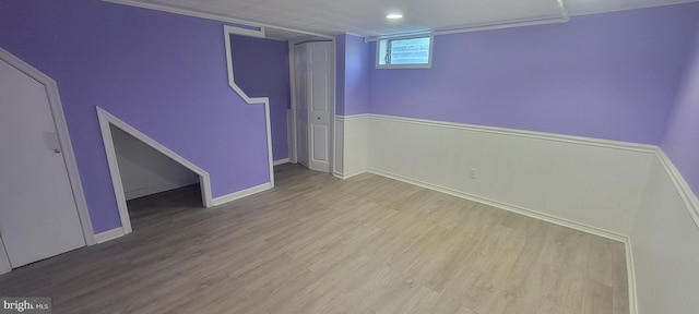 basement with wood finished floors and baseboards