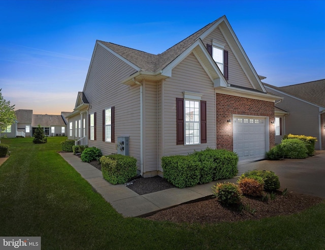 307 Obelisk Ln, Middletown, DE 19709 - view of property exterior with driveway, a lawn, and an attached garage