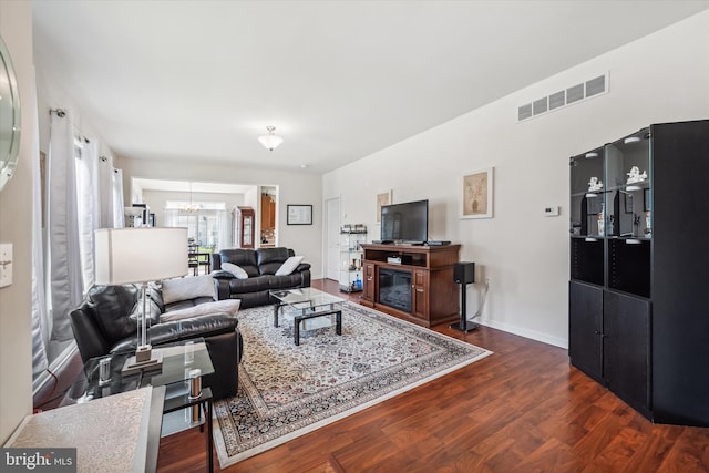 307 Obelisk Ln, Middletown, DE 19709 - living room with a chandelier, dark wood-style flooring, and baseboards