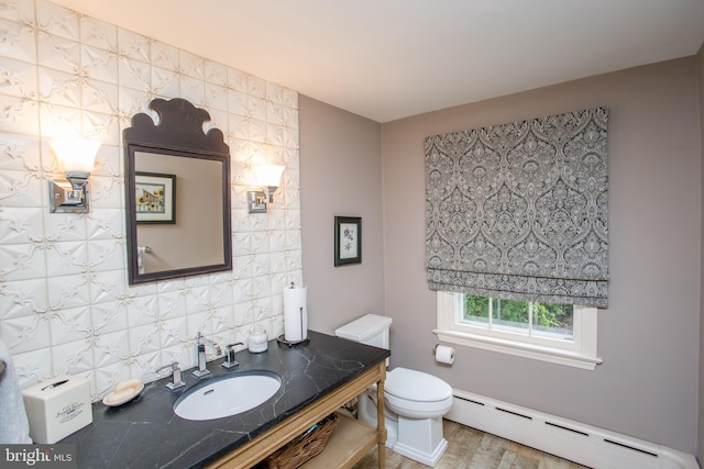 3864 Spring Valley Rd, Doylestown, PA 18902 - bathroom with a baseboard heating unit, toilet, vanity, backsplash, and wood finished floors
