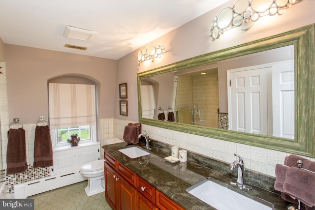 3864 Spring Valley Rd, Doylestown, PA 18902 - bathroom featuring a baseboard heating unit, double vanity, toilet, and backsplash