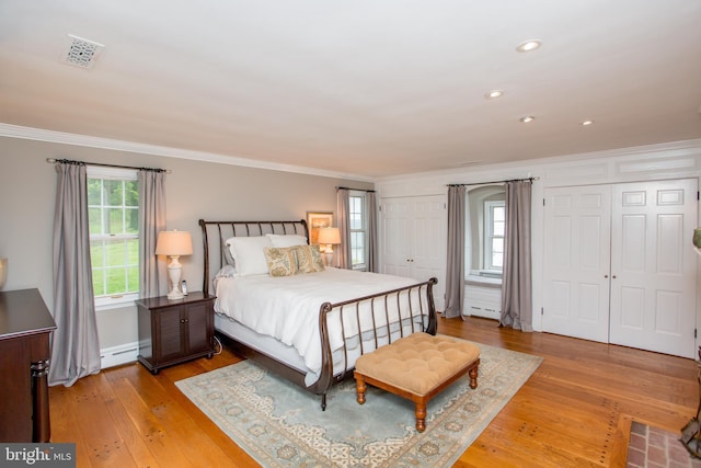 3864 Spring Valley Rd, Doylestown, PA 18902 - bedroom featuring multiple closets, ornamental molding, light wood-type flooring, recessed lighting, and baseboards