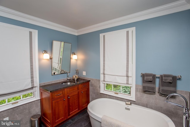 3864 Spring Valley Rd, Doylestown, PA 18902 - bathroom with tile walls, plenty of natural light, a soaking tub, vanity, and a wainscoted wall