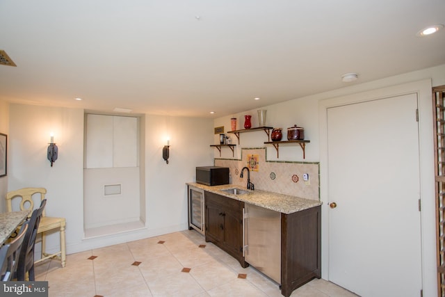 3864 Spring Valley Rd, Doylestown, PA 18902 - kitchen featuring a sink, open shelves, recessed lighting, light stone countertops, and dark brown cabinetry