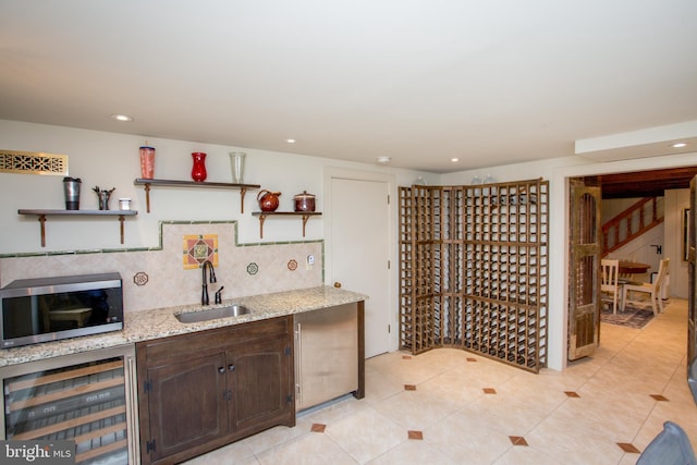 3864 Spring Valley Rd, Doylestown, PA 18902 - wine area featuring wine cooler, a sink, light tile patterned floors, and recessed lighting