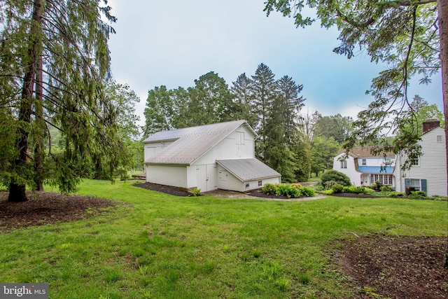3864 Spring Valley Rd, Doylestown, PA 18902 - view of property exterior featuring a lawn, an outbuilding, and metal roof