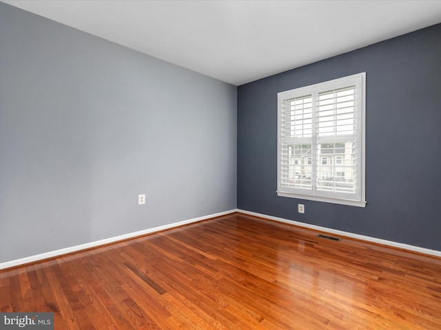 6521 Kemper Lakes Ct, Alexandria, VA 22312 - spare room with wood finished floors and baseboards