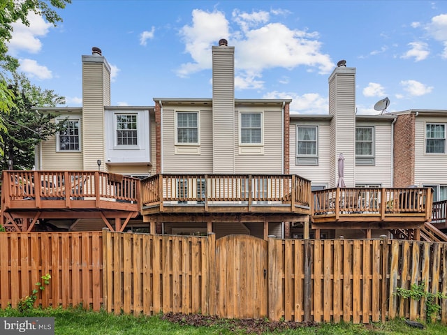 6521 Kemper Lakes Ct, Alexandria, VA 22312 - back of house featuring a deck and a chimney