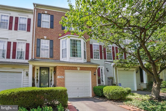 13304 Tivoli Fountain Ct, Germantown, MD 20874 - townhome / multi-family property featuring a garage and brick siding