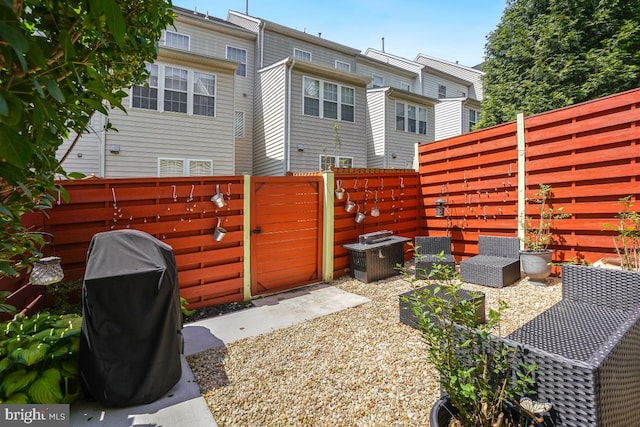 13304 Tivoli Fountain Ct, Germantown, MD 20874 - fenced backyard with a gate and a grill