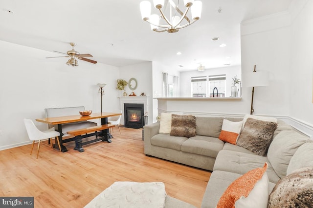 13304 Tivoli Fountain Ct, Germantown, MD 20874 - living room featuring a chandelier, recessed lighting, a fireplace with flush hearth, wood finished floors, and ceiling fan