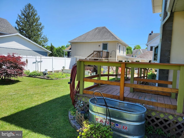 back of house with a wooden deck