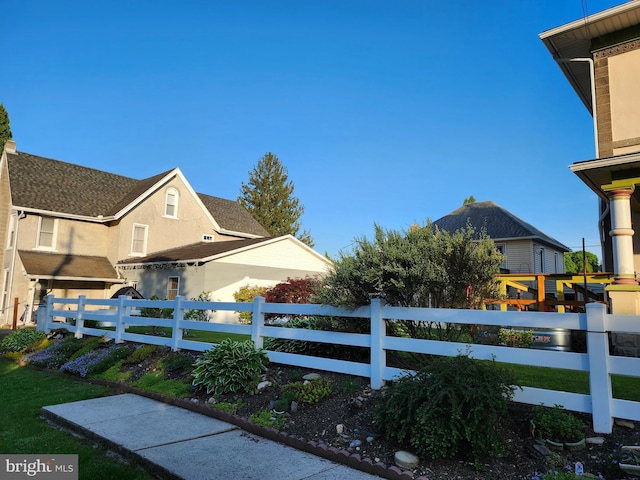 view of property exterior with a fenced front yard