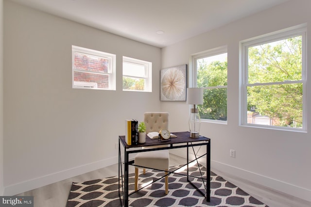 office with baseboards and wood finished floors