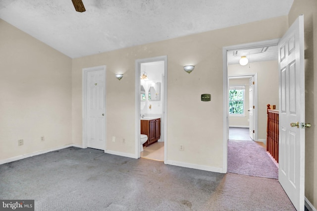 131 Remington Cir, Havre De Grace, MD 21078 - unfurnished bedroom with attic access, carpet, baseboards, connected bathroom, and a textured ceiling