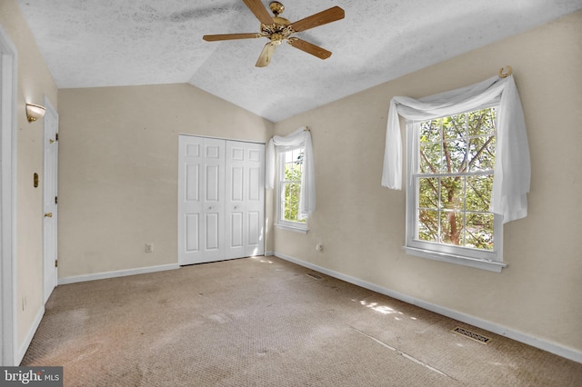 131 Remington Cir, Havre De Grace, MD 21078 - unfurnished bedroom with lofted ceiling, a closet, baseboards, a textured ceiling, and carpet