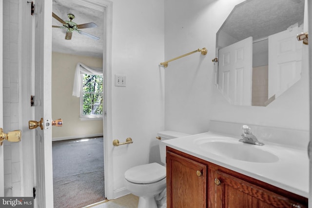 131 Remington Cir, Havre De Grace, MD 21078 - bathroom featuring vanity, toilet, a textured ceiling, baseboards, and a ceiling fan