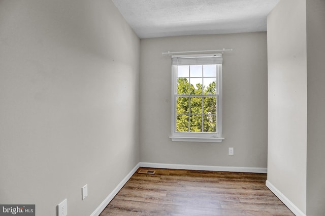 131 Remington Cir, Havre De Grace, MD 21078 - empty room featuring wood finished floors, baseboards, and a textured ceiling