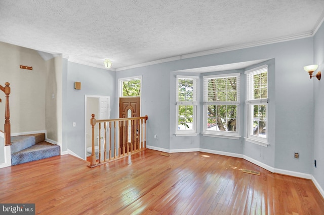 131 Remington Cir, Havre De Grace, MD 21078 - spare room with wood-type flooring, ornamental molding, baseboards, and a textured ceiling