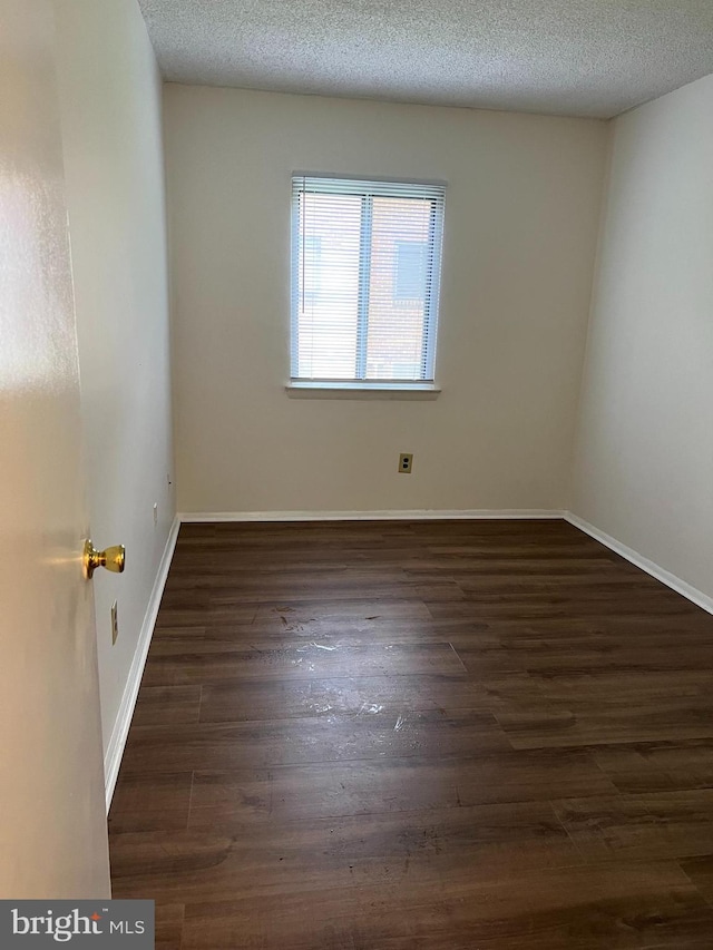 842 Putnam Blvd Unit 60A, Wallingford, PA 19086 - unfurnished room featuring wood finished floors, baseboards, and a textured ceiling