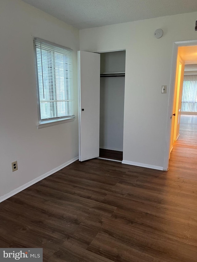 842 Putnam Blvd Unit 60A, Wallingford, PA 19086 - unfurnished bedroom with wood finished floors, a closet, and baseboards