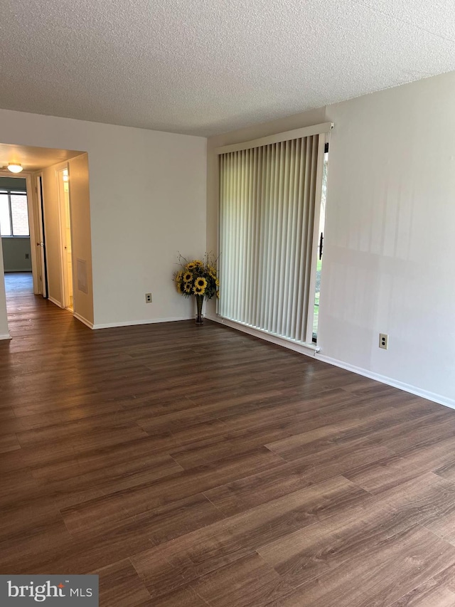 842 Putnam Blvd Unit 60A, Wallingford, PA 19086 - empty room with baseboards, wood finished floors, and a textured ceiling
