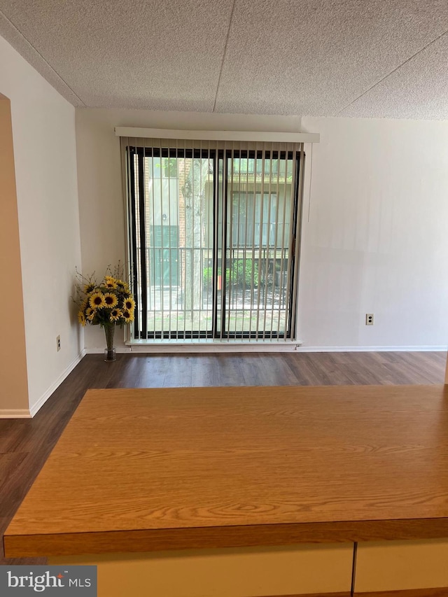 842 Putnam Blvd Unit 60A, Wallingford, PA 19086 - empty room featuring wood finished floors, a textured ceiling, and baseboards