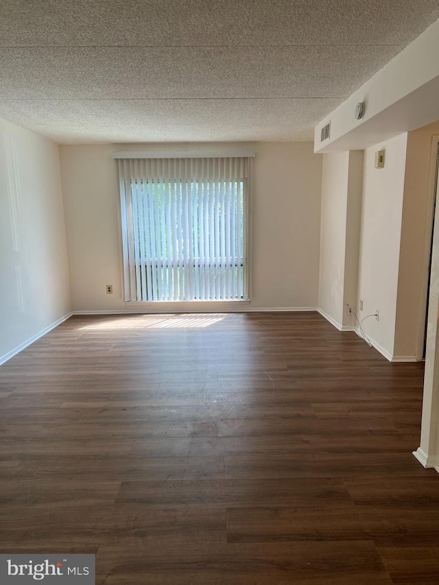 842 Putnam Blvd Unit 60A, Wallingford, PA 19086 - spare room with dark wood-style floors, a textured ceiling, and baseboards