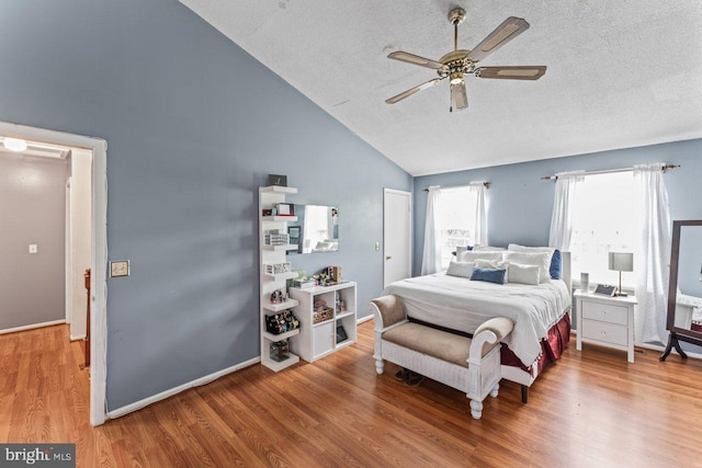 10103 Wimbledon Ct, Manassas, VA 20110 - bedroom with high vaulted ceiling, wood finished floors, a textured ceiling, and ceiling fan