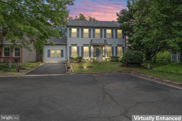 10103 Wimbledon Ct, Manassas, VA 20110 - colonial inspired home with asphalt driveway and a front yard