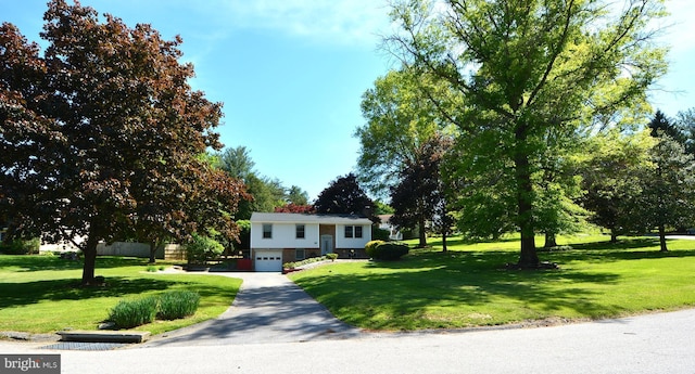 26 Shamrock Cir, Westminster, MD 21157 - bi-level home with a garage, driveway, and a front lawn