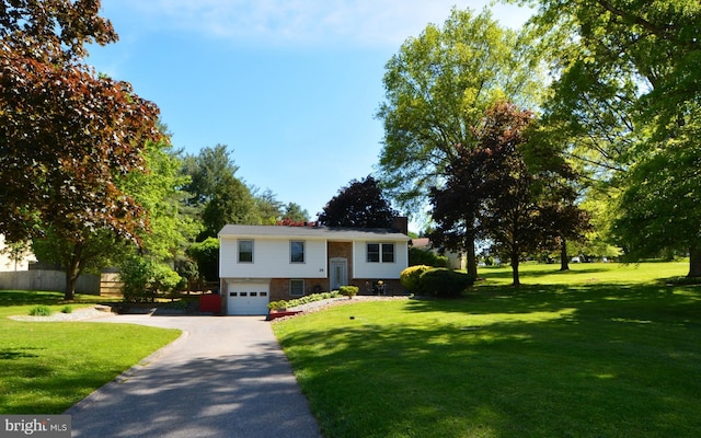 26 Shamrock Cir, Westminster, MD 21157 - split foyer home featuring asphalt driveway, a garage, and a chimney