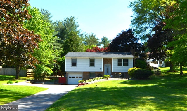 26 Shamrock Cir, Westminster, MD 21157 - split foyer home with an attached garage, driveway, a chimney, and brick siding