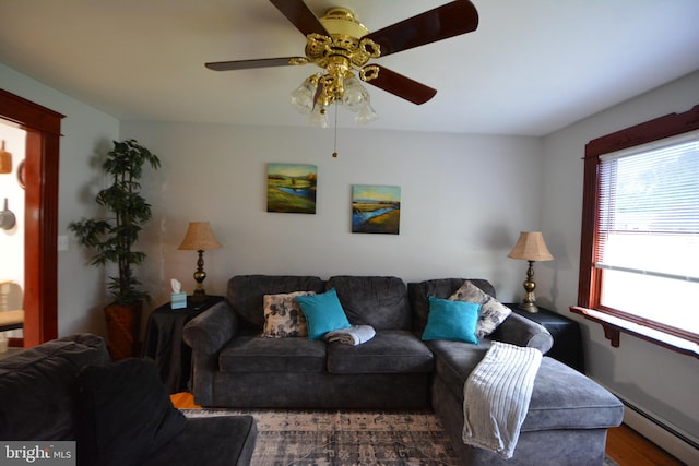 26 Shamrock Cir, Westminster, MD 21157 - living room featuring ceiling fan, a baseboard heating unit, and wood finished floors