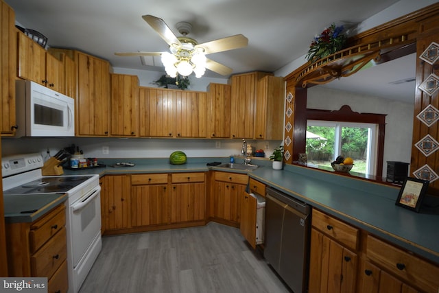 26 Shamrock Cir, Westminster, MD 21157 - kitchen featuring white appliances, a sink, light wood-type flooring, a ceiling fan, and brown cabinets