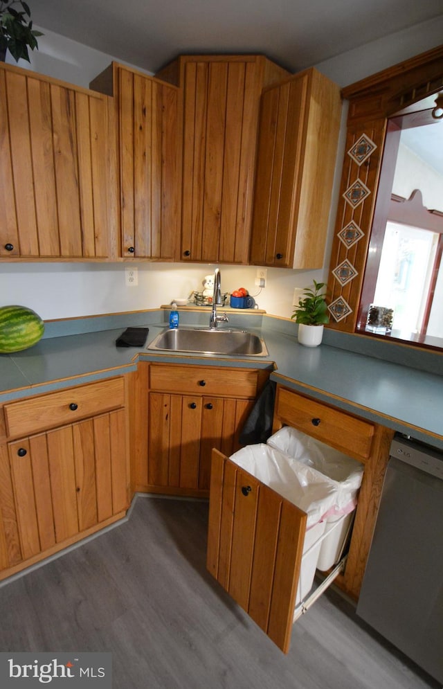 26 Shamrock Cir, Westminster, MD 21157 - kitchen with dishwasher, a sink, wood finished floors, and brown cabinetry