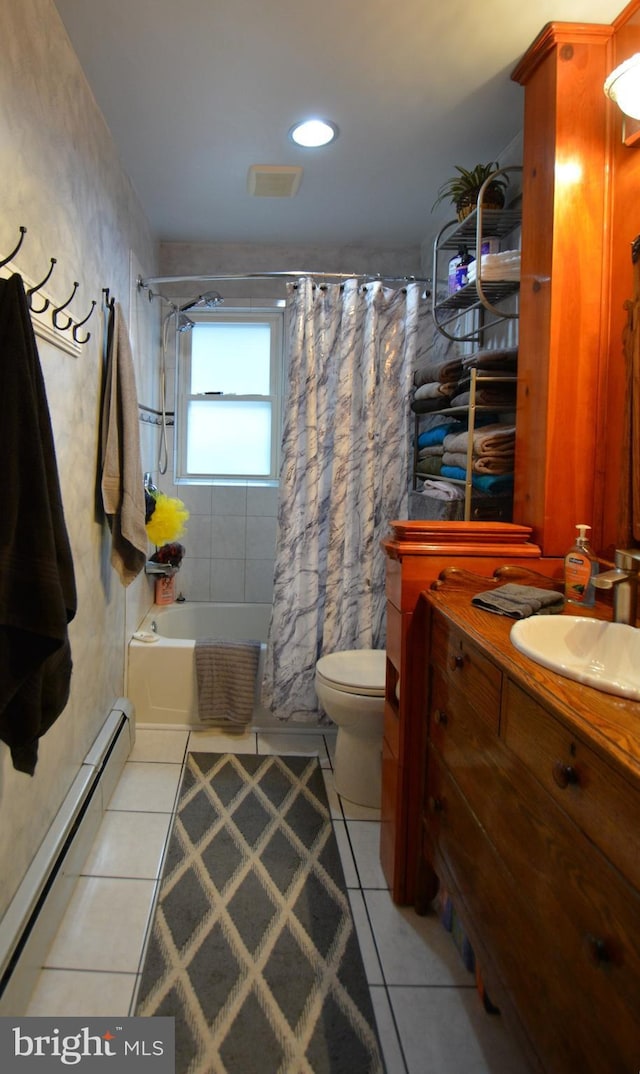 26 Shamrock Cir, Westminster, MD 21157 - full bath featuring tile patterned floors, a baseboard radiator, toilet, shower / tub combo, and vanity