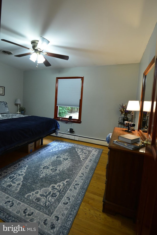 26 Shamrock Cir, Westminster, MD 21157 - bedroom featuring a baseboard radiator, wood finished floors, and ceiling fan