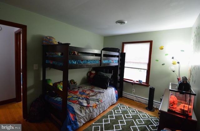 26 Shamrock Cir, Westminster, MD 21157 - bedroom with baseboard heating and wood finished floors