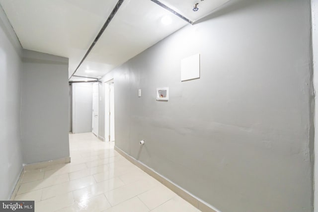 corridor with baseboards and recessed lighting