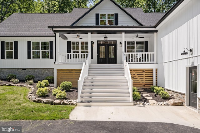 5570 Warren Dr, Huntingtown, MD 20639 - view of front of house featuring ceiling fan, a porch, stairway, and a shingled roof