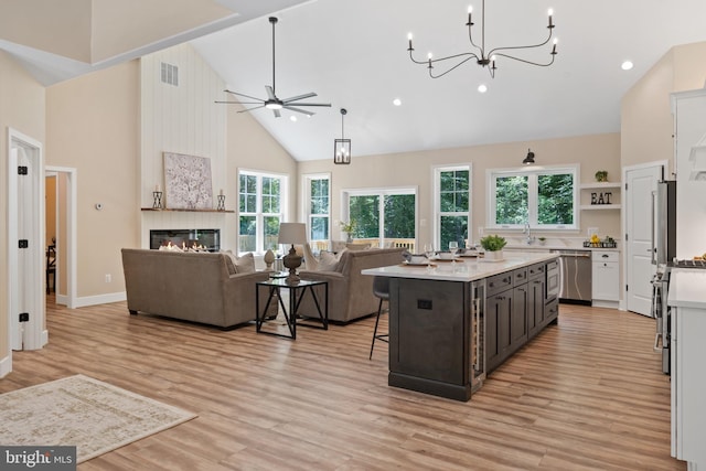 5570 Warren Dr, Huntingtown, MD 20639 - kitchen with high vaulted ceiling, appliances with stainless steel finishes, light countertops, healthy amount of natural light, and open floor plan